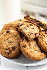 Tasty biscuits with chocolate. Sweet chocolate cookies on plate.