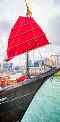 HONG KONG - MAY 12, 2014: Tourist sailboat Aqua Luna on a cloudy day. View from across Victoria...