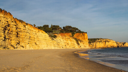 Fototapeta na wymiar sunset over beautiful cliff beach in Lagos, Algarve, Portugal
