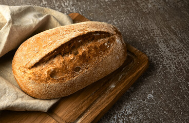 Wholegrain rye bread on a cutting board