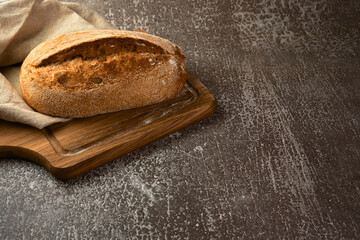 Wholegrain rye bread on a cutting board