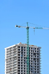 Crane and highrise construction site