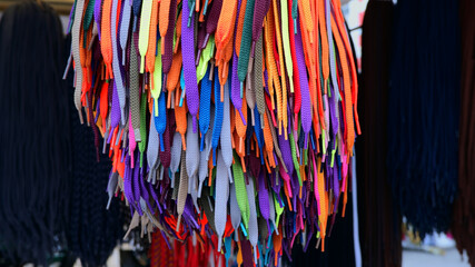 Bright colorful shoelaces at a street market in Valencia