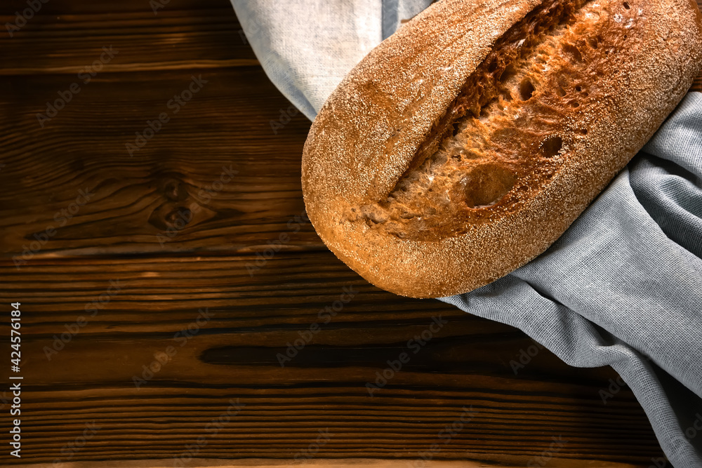 Wall mural wholegrain rye bread on a cutting board