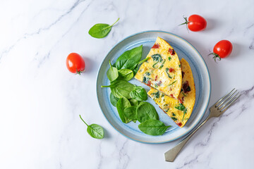 Spinach Dried tomatoes Frittata in a plate