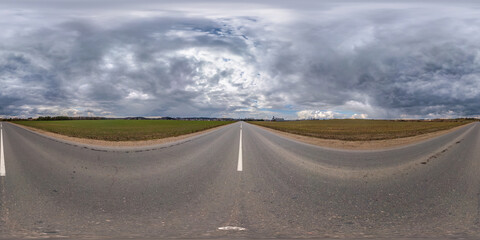 full seamless spherical hdri panorama 360 degrees angle view on asphalt road among fields in nasty day with overcast sky in equirectangular projection, ready for VR AR virtual reality