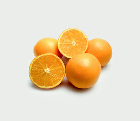 Fresh orange fruits (Citrus sinensis) on white background.