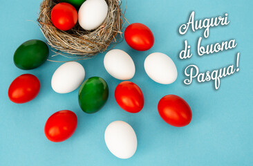 Happy Easter holiday text in italian card, Easter eggs as the color of the Italian flag - green, white, red	
