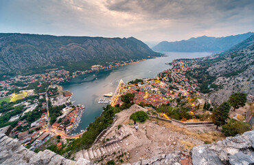 Kotor Bay and Old Town illumiinated at dusk seen from St John's Fortress and hilltop,Montenegro,Eastern Europe.