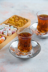 Vertical photo of Two glass tea and turkish delights