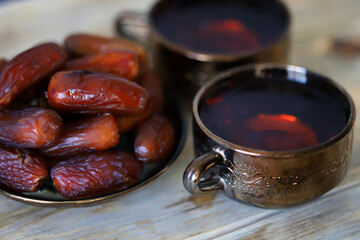 Date tea in a cup. Dried dates. Ramadan concept. Arabic drink.