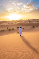 Berber man wearing traditional clothes in the Sahara Desert at dawn, Morocco