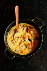 traditional kerala style beef coconut curry with vegetables.