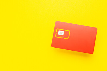 sim card for mobile phone isolated on yellow background. 4G sim card for smartphone cut out