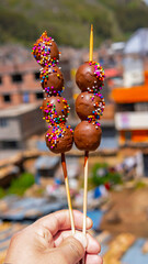 grapes covered with chocolate and candies a typical delicacy in Peru for the feast of Holy Week in La
 city ​​of huancavelica peru