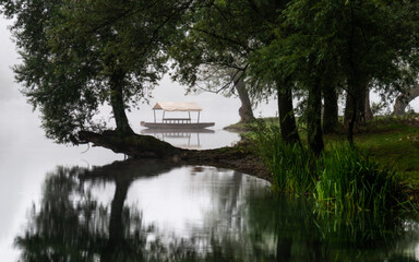 Obraz premium fog over the river with boat