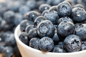 fresh ripe blueberries in a glass bowl