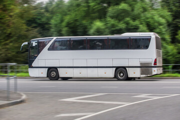 bus moves down the street