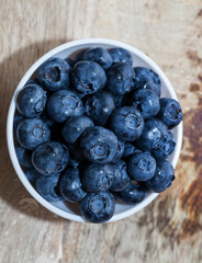 fresh ripe blueberries in a glass bowl