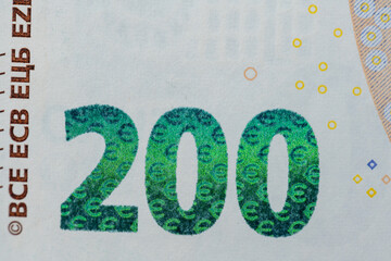 Two Hundred Euro Banknotes, closeup of Euro Bills and design of yellow Banknote from European Central Bank