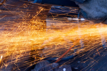 old metal surface and sawing it into parts and pieces
