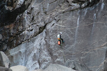 Rock climb and abseil along a cliff waterfall in Yosemite National Park, California