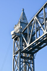 A closeup of the top part of a tower of the Cape Cod Canal Railroad Bridge, a vertical lift bridge in Bourne, Massachusetts near Buzzards Bay.