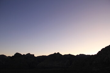 Mountain silhouette desert sky at sunset