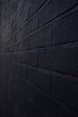 Black brick wall painted as a graffiti background