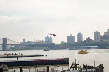 Fototapeta premium Staten Island Ferry and Lower Manhattan Skyline, New York City, helicopter, USA.