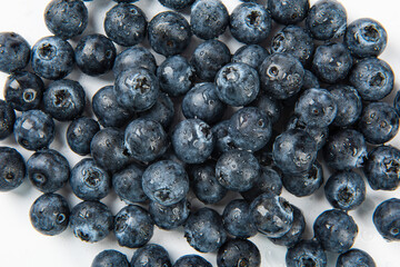 Water drops on ripe sweet blueberry. Fresh blueberries background