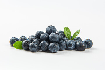 Fresh blueberry with drops of water on white background