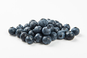 Fresh blueberry with drops of water on white background