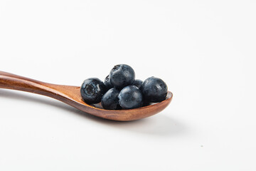 Fresh blueberry with drops of water on white background