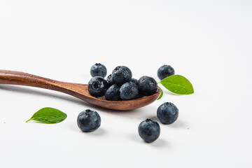 Fresh blueberry with drops of water on white background