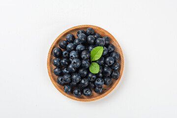 Fresh blueberry with drops of water on white background