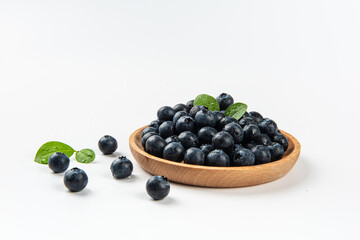 Fresh blueberry with drops of water on white background