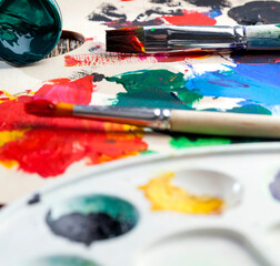 Fototapeta premium mixed together multi-colored paints for creativity and drawing