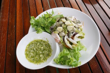 fresh spicy seafood on white plate