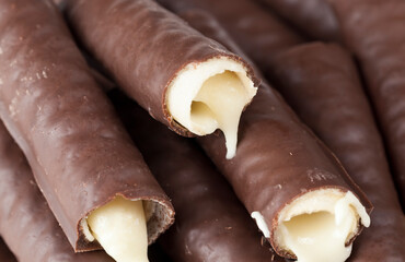 broken waffle tubes with filling, milk filling flows out