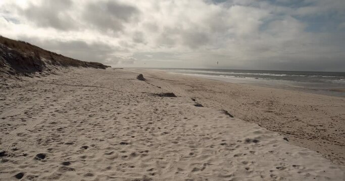 West Beach Of Sylt On A Sunny Day With Kite Surfers On The Sea