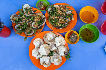 Vietnamese delicious grilled seafood and snails meal for dinner