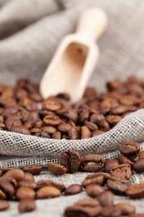 brown coffee beans lying on a table made of boards