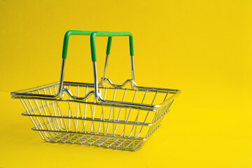 The grocery basket is empty. Metal basket for purchases in the store.