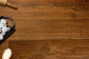 Topview of a rustic wooden table with some objects