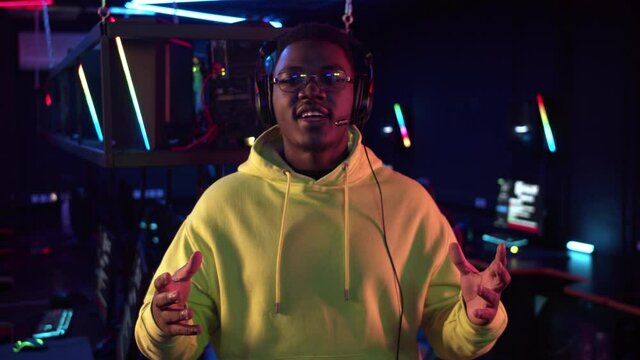 A dark-skinned commentator of esports matches leads a live broadcast from the online games championship