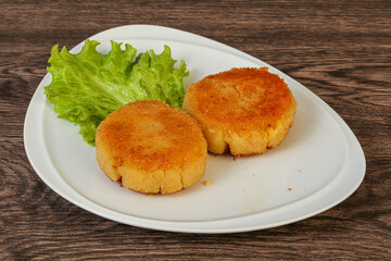 Vegan cuisine - Potato cutlet in the plate