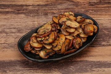 Roasted champignon with herbs and spices