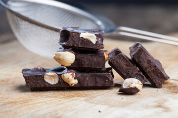 divided into pieces a piece of chocolate from cocoa