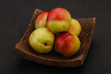 Sweet small nectarines in the basket